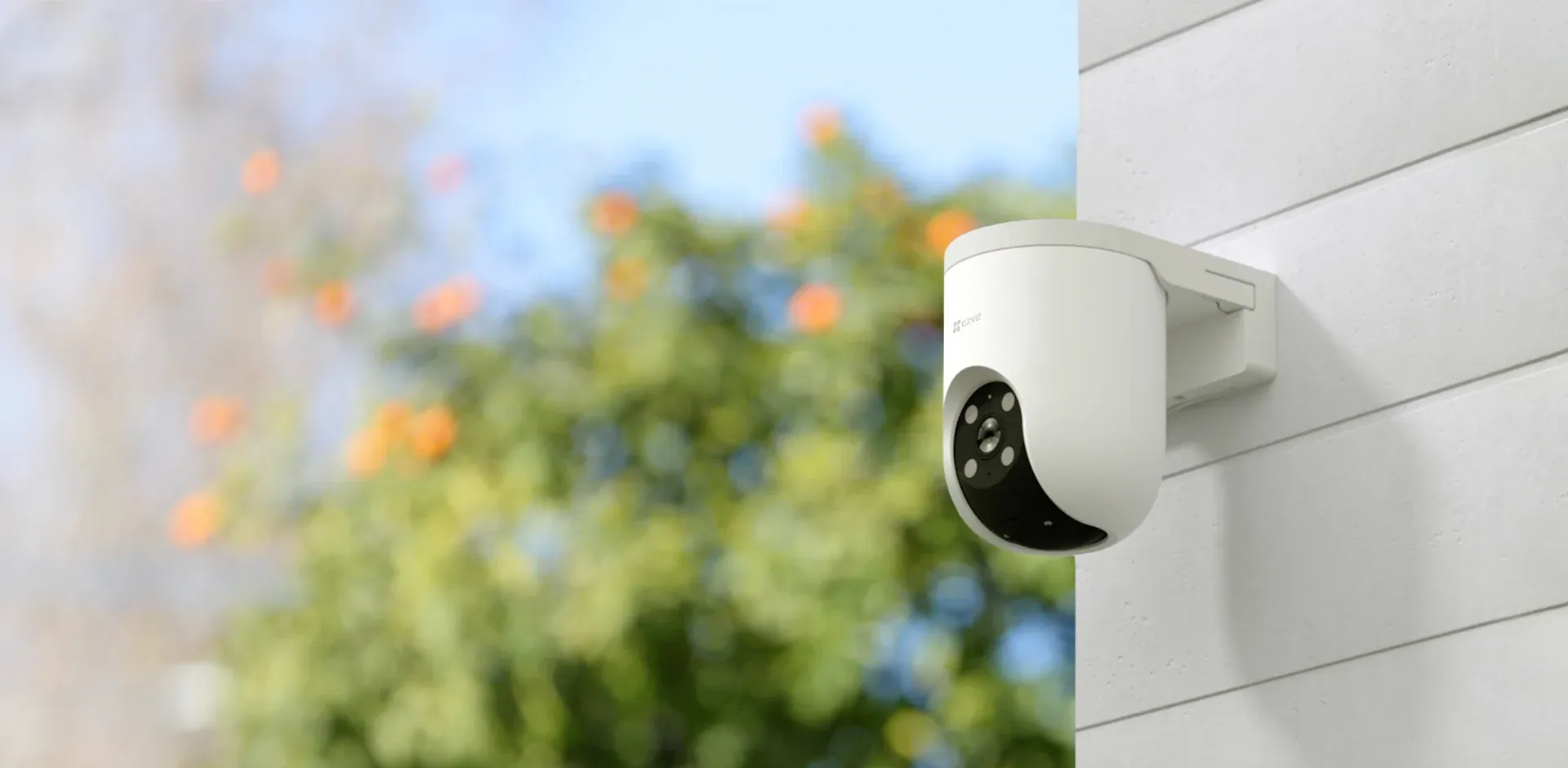 EZVIZ H8c Pro 2K pan and tilt outdoor Wi-Fi camera mounted on a wall