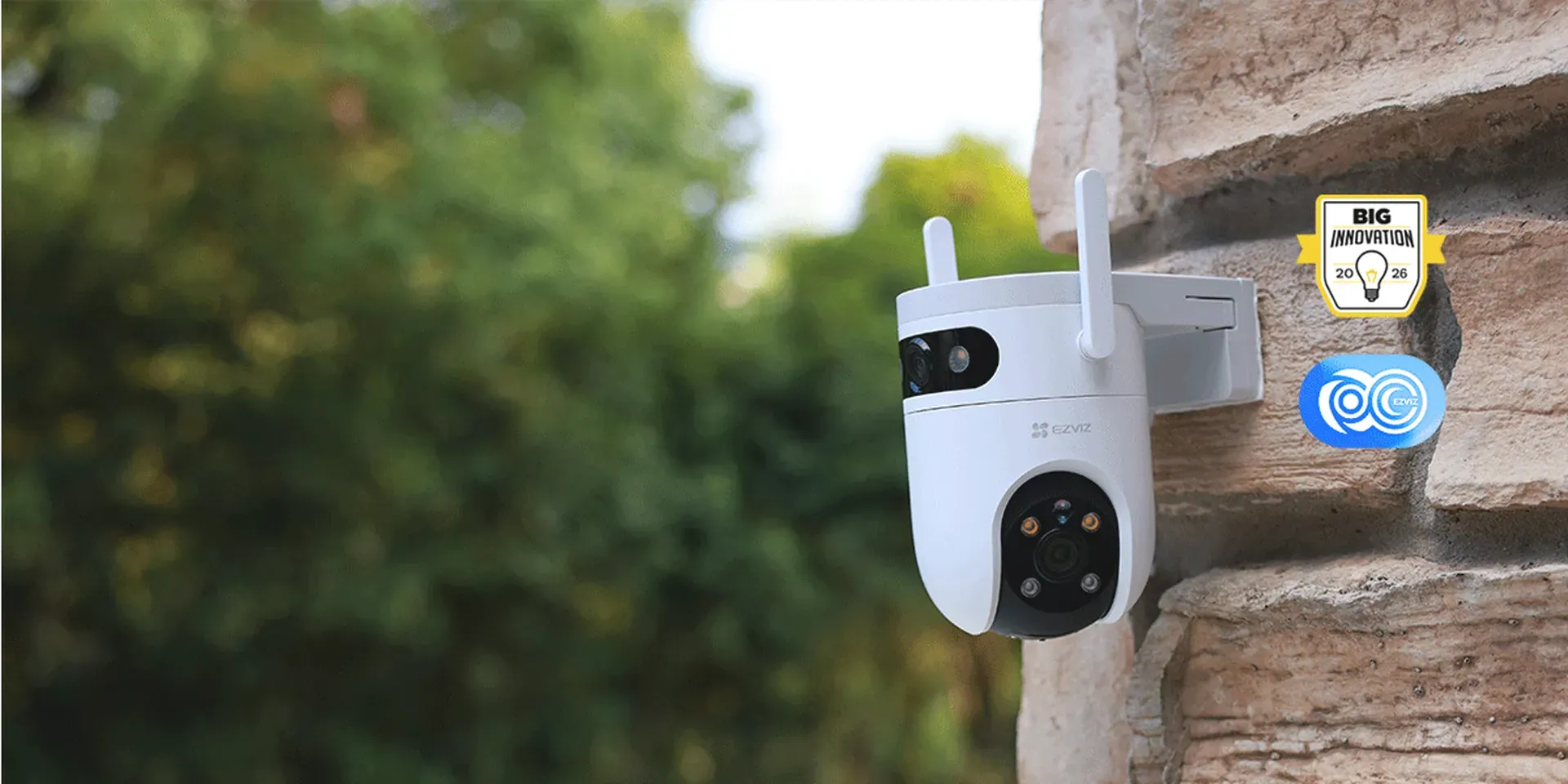 EZVIZ H9c Dual 2K & 2K dual-lens pan and tilt outdoor Wi-Fi camera mounted on a stone wall