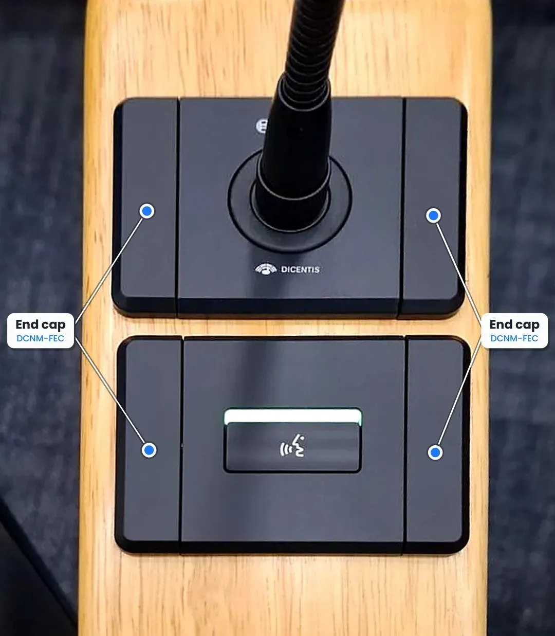 DCNM-FEC end caps fitted on both ends of two DICENTIS Flush panels in a wooden armrest