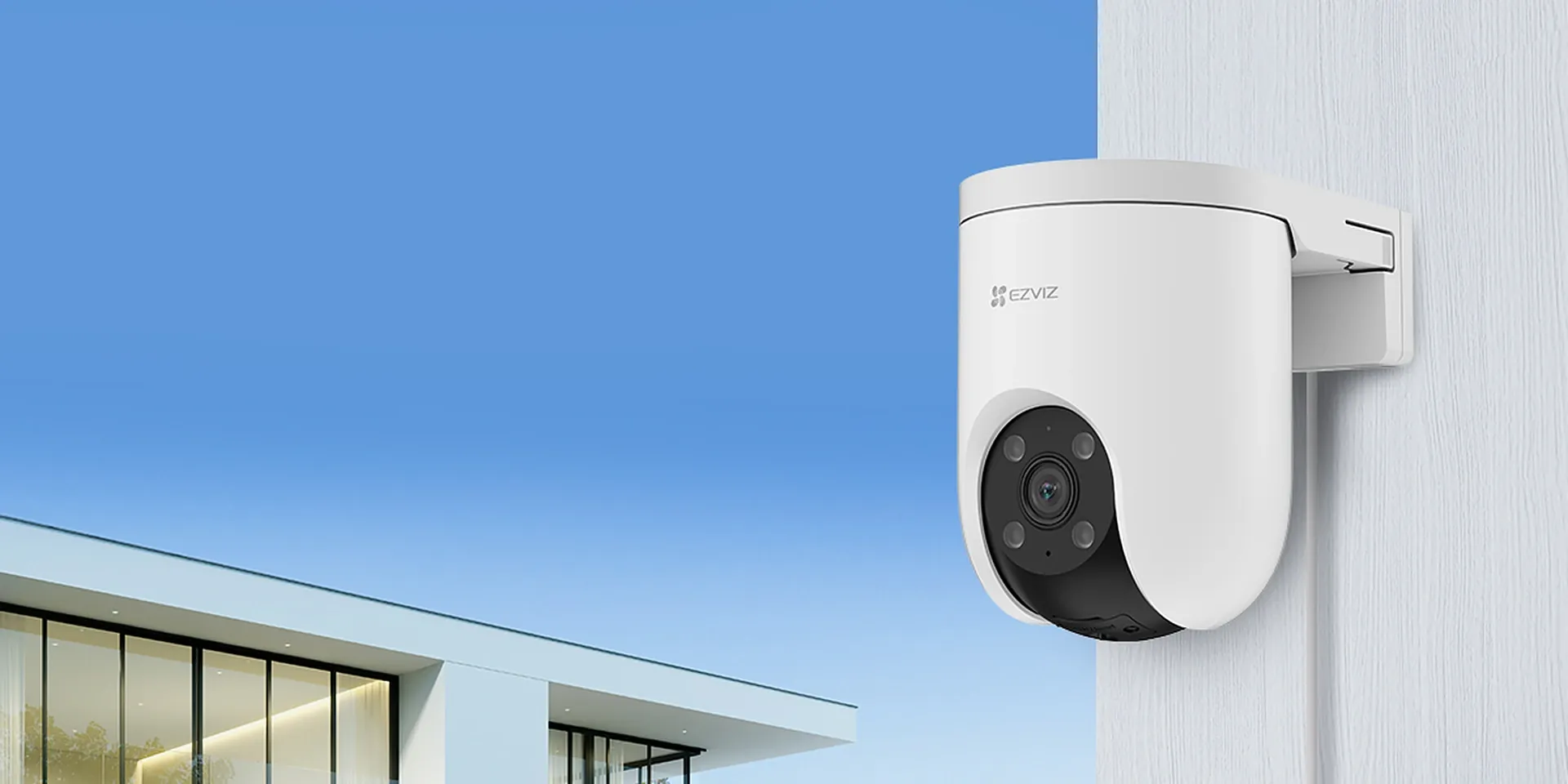 EZVIZ H8c PoE 2K pan and tilt PoE security camera mounted on an outdoor wall