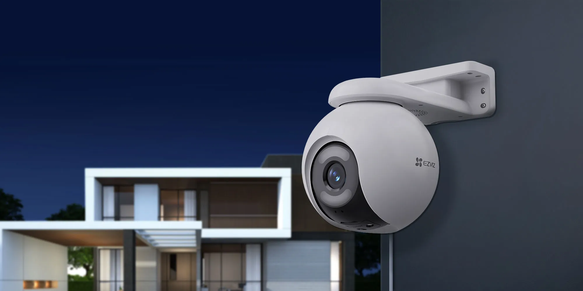 EZVIZ H8x 2K+ pan and tilt Wi-Fi camera mounted on an outdoor wall at night
