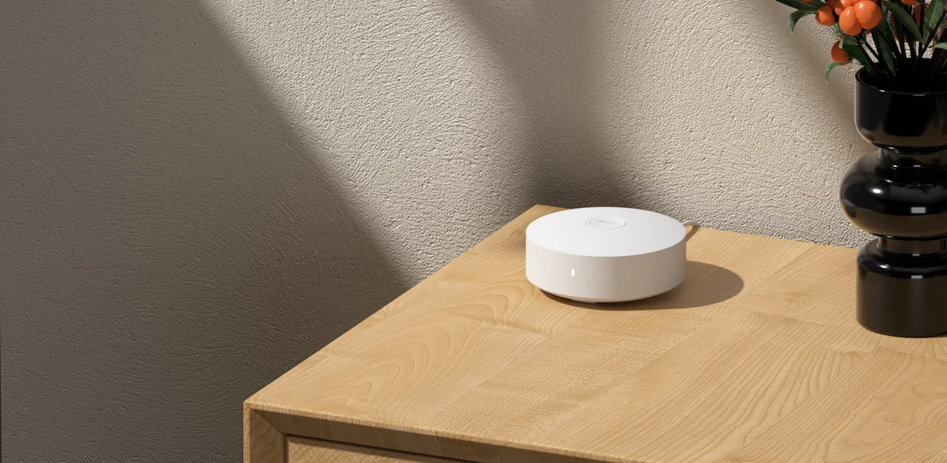 EZVIZ A3-R200 Home Gateway on a wooden side table