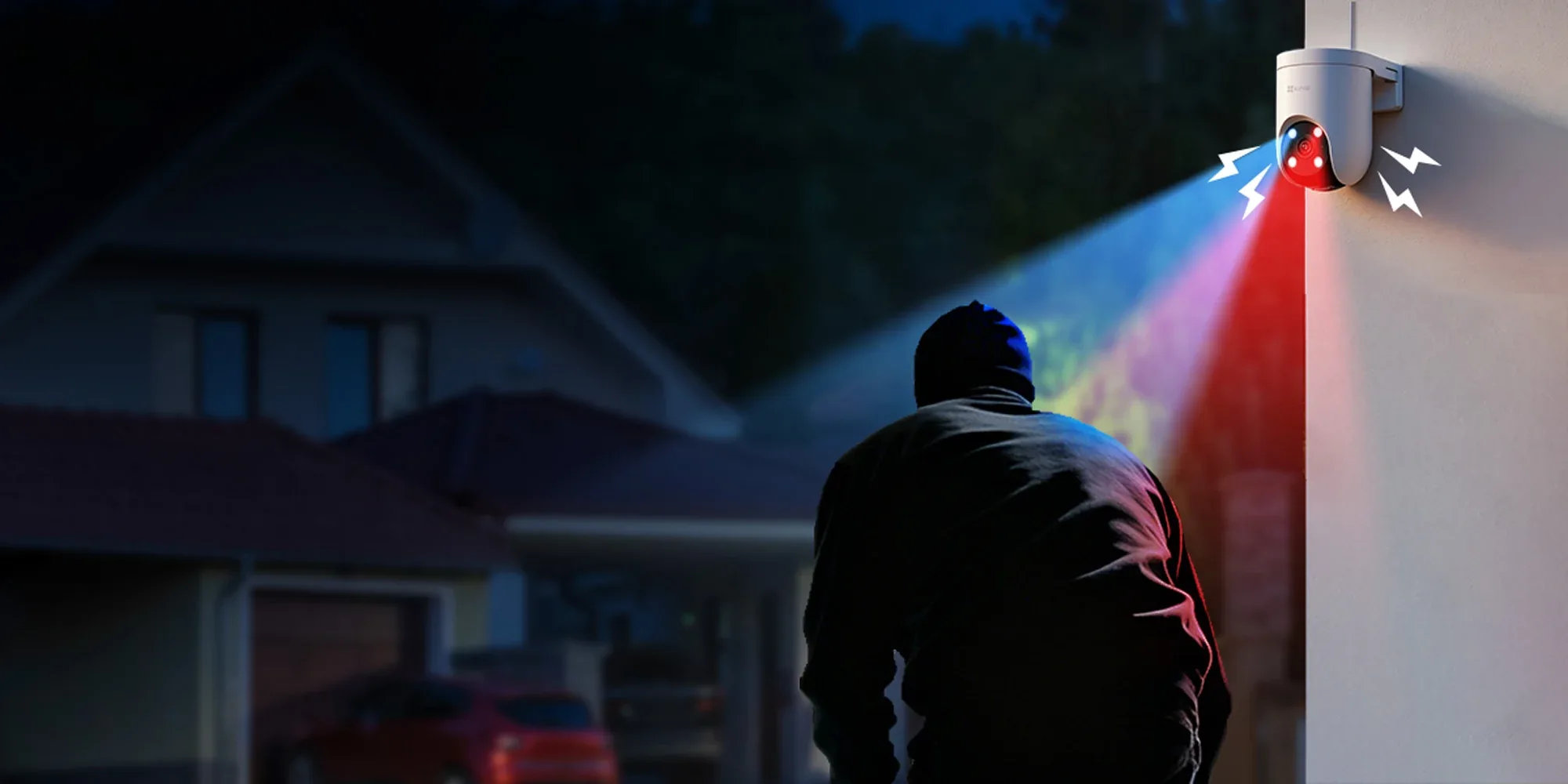 EZVIZ H8c Pro flashing red and blue warning lights at an intruder