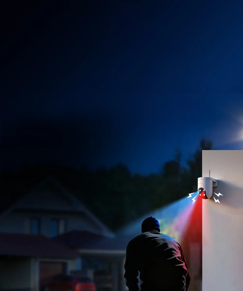 EZVIZ H8c Pro flashing red and blue warning lights at an intruder