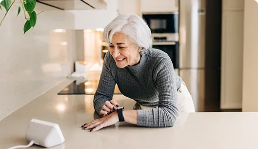 Woman viewing the EZVIZ H8c Pro 4G feed on a smart display