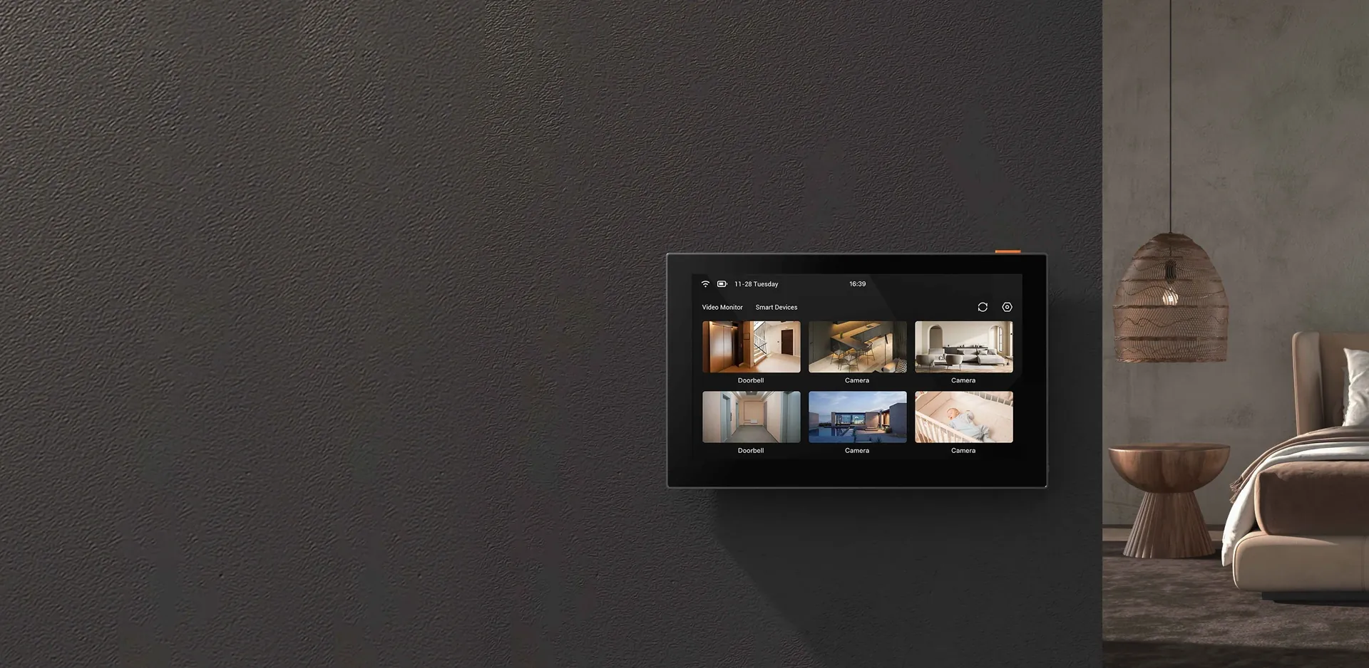 EZVIZ SD7 smart screen mounted on a dark wall showing doorbell and camera views