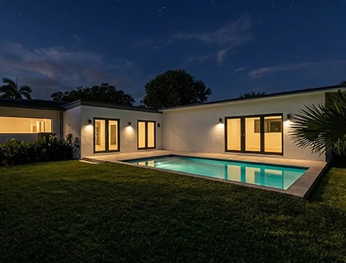 EZVIZ HB9c full-color night vision of a house and pool lit by two spotlights